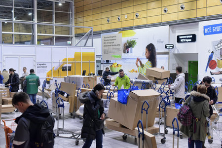 Russia, St. Petersburg 20-12-2018 Buyers with carts at the point of delivery of goods in Ikea