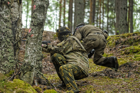St. Petersburg, Russia 12-07-2016 Paintball players in full gear at the shooting range, tournament...