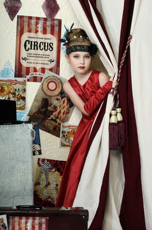 little girl in vintage style in red dressの写真素材