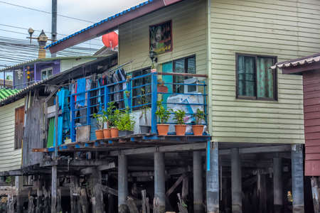 Bangkok, Thailand - 08/18/2019: A serene warren of canals, floating houses and stilt houses over the Chao Phraya River, at Krung Thon Bridge (Saphan Sang Hi)のeditorial素材