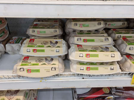 Russia, St. Petersburg 01/04/2021 Packages of eggs for sale on supermarket shelvesのeditorial素材