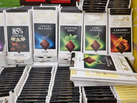 Russia, St. Petersburg 04.01.2021 Packages of chocolate on sale on supermarket shelvesのeditorial素材