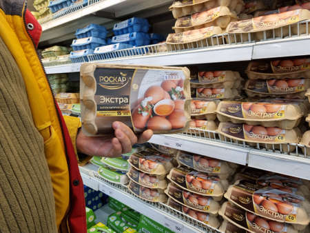 Russia, St. Petersburg 01/04/2021 Packages of eggs for sale on supermarket shelvesのeditorial素材
