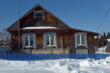 Russia, Izhevsk 28,02,2021 Wooden house in the Russian village in winterのeditorial素材