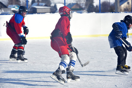 Russia, Kechevo, 12,02,2021 Playing ice hockey on an outdoor ice rink