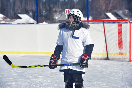 Russia, Kechevo, 12,02,2021 Playing ice hockey on an outdoor ice rink