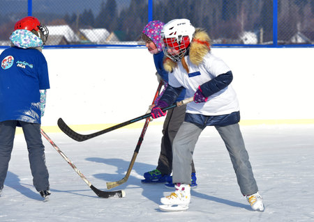 Russia, Kechevo, 12,02,2021 Playing ice hockey on an outdoor ice rink