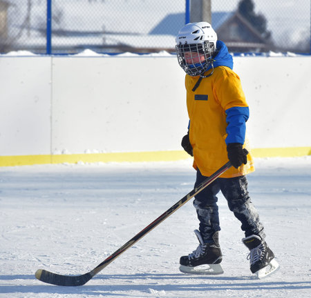 Russia, Kechevo, 12,02,2021 Playing ice hockey on an outdoor ice rink