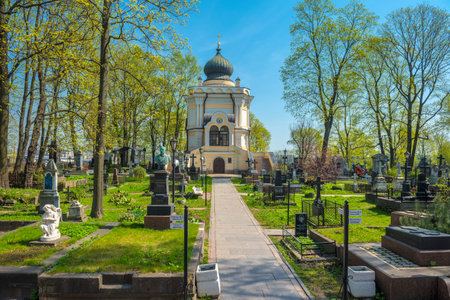 Saint Petersburg, Russia - 14.05.2021- Monuments of the Nikolskoe Cemetery and the Church of Saint...