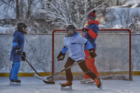 Russia, St. Petersburg 17.03.2019 12.02.2021 Playing ice hockey on an outdoor ice rink