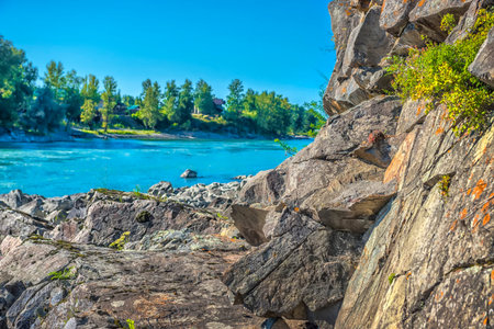 katun river with turquoise water and stones in the foreground