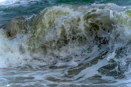 A powerful wave breaks along the coast in the Black Seaの写真素材