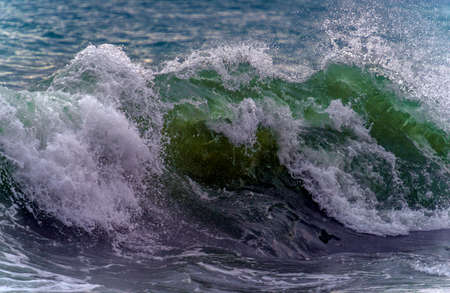 A powerful wave breaks along the coast in the Black Seaの写真素材