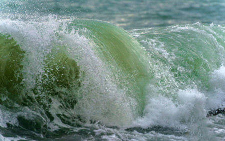 A powerful wave breaks along the coast in the Black Seaの写真素材