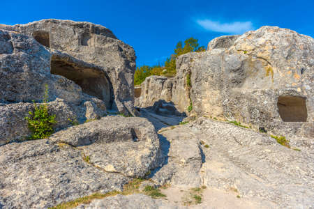 Ancient stone caves in a town-fortess Eski-Kermen high in a rocky mountains, Crimea. Top view.の写真素材