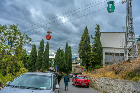 Crimea, Yalta 09/20/2021. Orange funicular cabin and aerial city skyline panoramic view