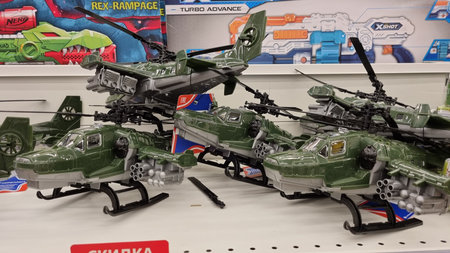 Russia. St. Petersburg 20.01.2022 Children's toys military equipment for sale in a supermarketのeditorial素材