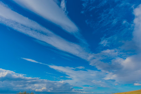clouds in the blue sky over the steppeの写真素材