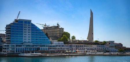 Panoramic view from the embankment of the artillery bay (in the distance is the grand city obelisk-monuments "soldier and sailor" and "bayonet-sail" in Sevastopol 2024の写真素材