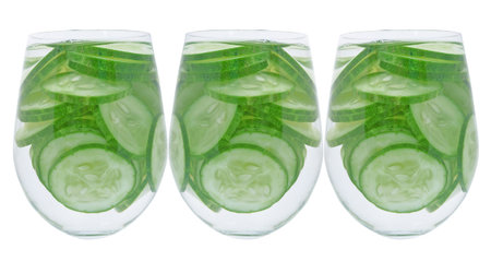 sliced cucumber isolated on white backgroundの写真素材