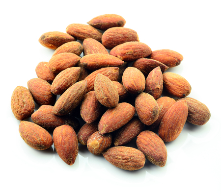 tasty almonds nuts, isolated on whiteの写真素材