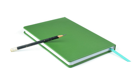 Green notebook isolated on white background.の写真素材