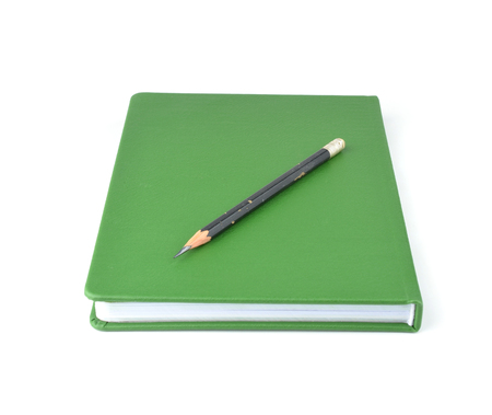 Green notebook isolated on white background.の写真素材