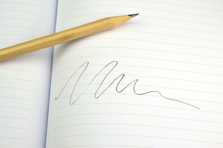 Notebooks and pencil on white の写真素材