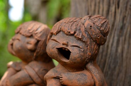 Clay dolls in the gardenの写真素材