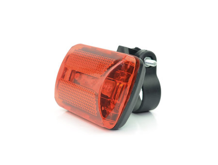 Red bicycle rear lamp on white background.の写真素材