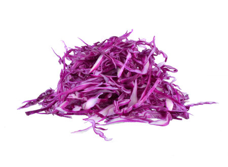 pile of cut red cabbage over white backgroundの写真素材