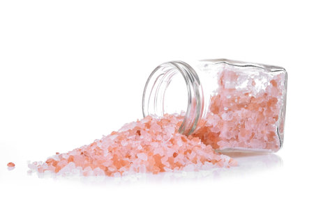 himalayan pink salt isolated on white backgroundの写真素材
