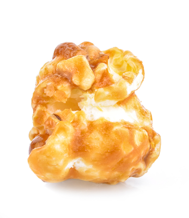 pieces of caramel popcorn on a white backgroundの写真素材