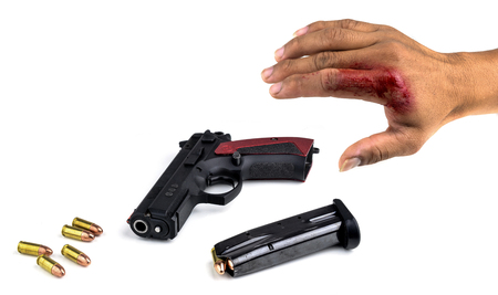 Black gun and 9mm bullets isolated a white background.の写真素材