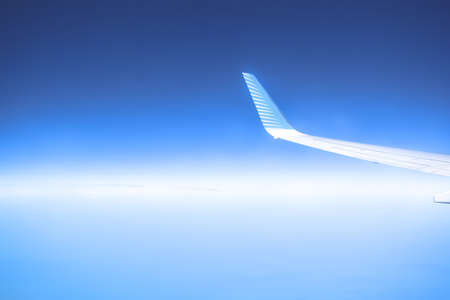 Airplane in the blue skyの写真素材
