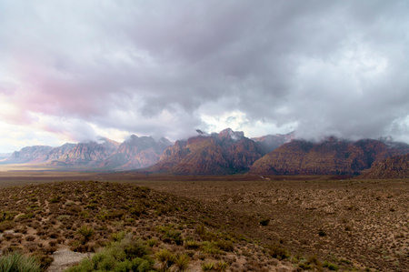 Colorful Storm Clouds hovering over Mountains in Desertの写真素材