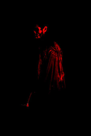 Young man dressed as a skull on a black backgroundのeditorial素材