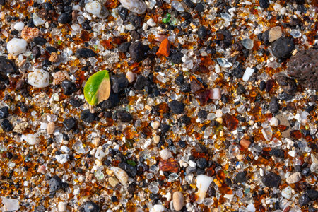 Glass Beach - EleÊ»ele, Kauai, Hawaii. Close up of rounded glass and lava rock fragments that...