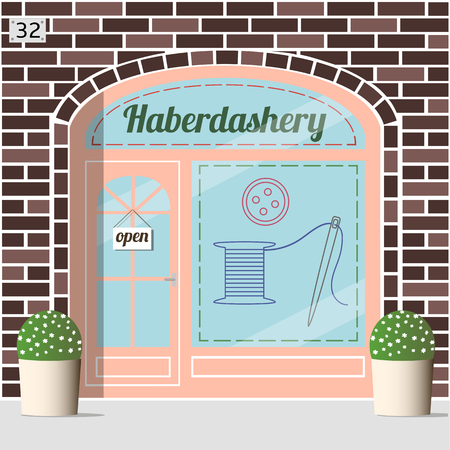 Haberdashery shop facade. Spool with threads, sewing button and needle sticker on window.Brown brick facade.のイラスト素材
