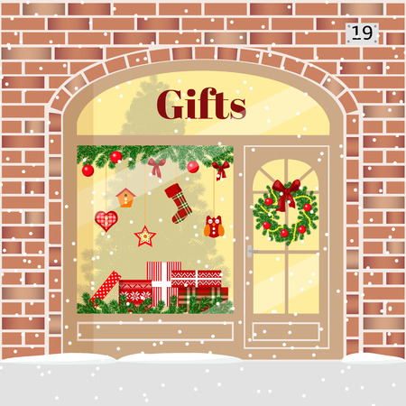 Christmas gifts shop (presents store). Decorated and illuminated brick facade with boxes, wreath, garland, balls, xmas tree, snowflakes. Vector illustration. For postcards prints banner. cozy buildingのイラスト素材