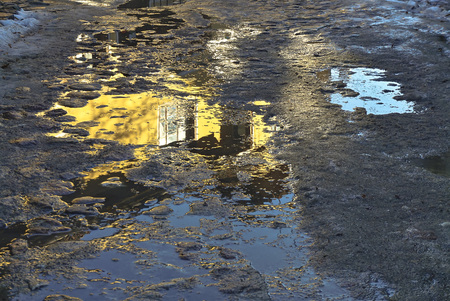 a reflection of the old window in the sunniest winter dayの写真素材