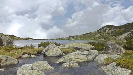 Lake which is located high in the mountains. Heaven is a very streaky cloudsの写真素材