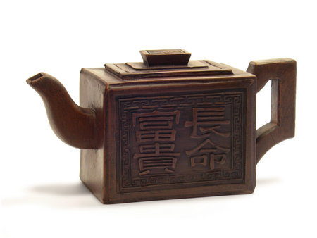 Ancient Chinese handicraft clay teapot isolated on a white background.の写真素材