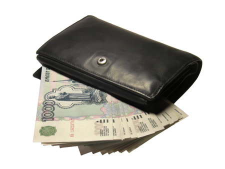 Black leather wallet bulging with Russian thousand rubles banknotes isolated on a white background.の写真素材