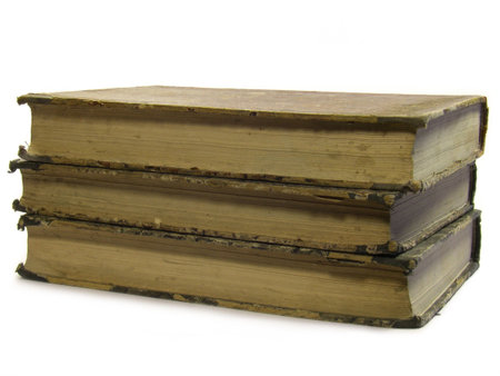 Stack of three very old books isolated on white background.の写真素材