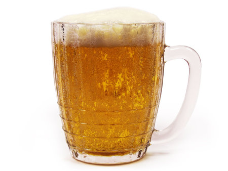 Big mug of lager beer with froth isolated on white background.の写真素材