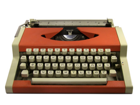 Red typewriter with cyrillic keyboard layout isolated on white background.の写真素材