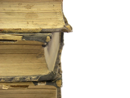 Part of three old books isolated on white background.の写真素材