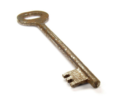 Old rusty key isolated on white background.の写真素材