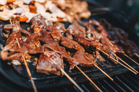 Traditional Peruvian food 'Anticuchos', meat skewers and chicken skewers cooked on the grill